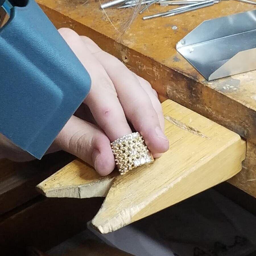 Inspecting a large gold ring