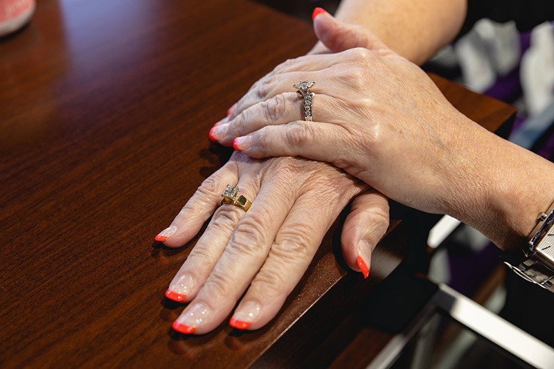 A women wearing diamond rings